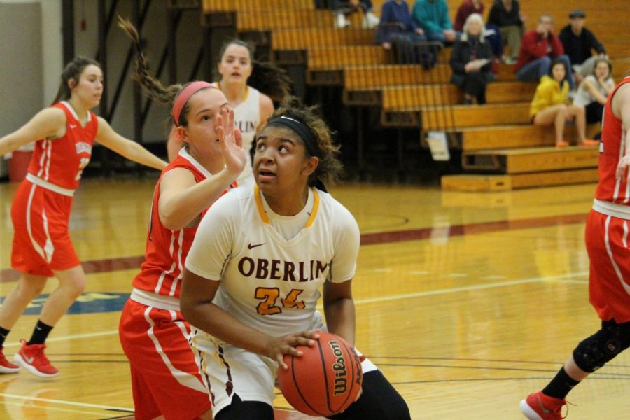 Senior guard Tyler Parlor rises up against a Denison University Big Red defender in the Yeowomen’s 62–56 win Wednesday. Parlor netted seven points in the Yeowomen’s third straight conference win.