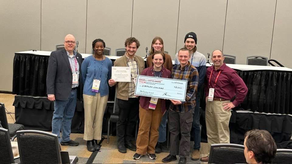 The renovation proposal team poses with their award at the USITT Conference. Photo courtesy of Jamie Benjamin.